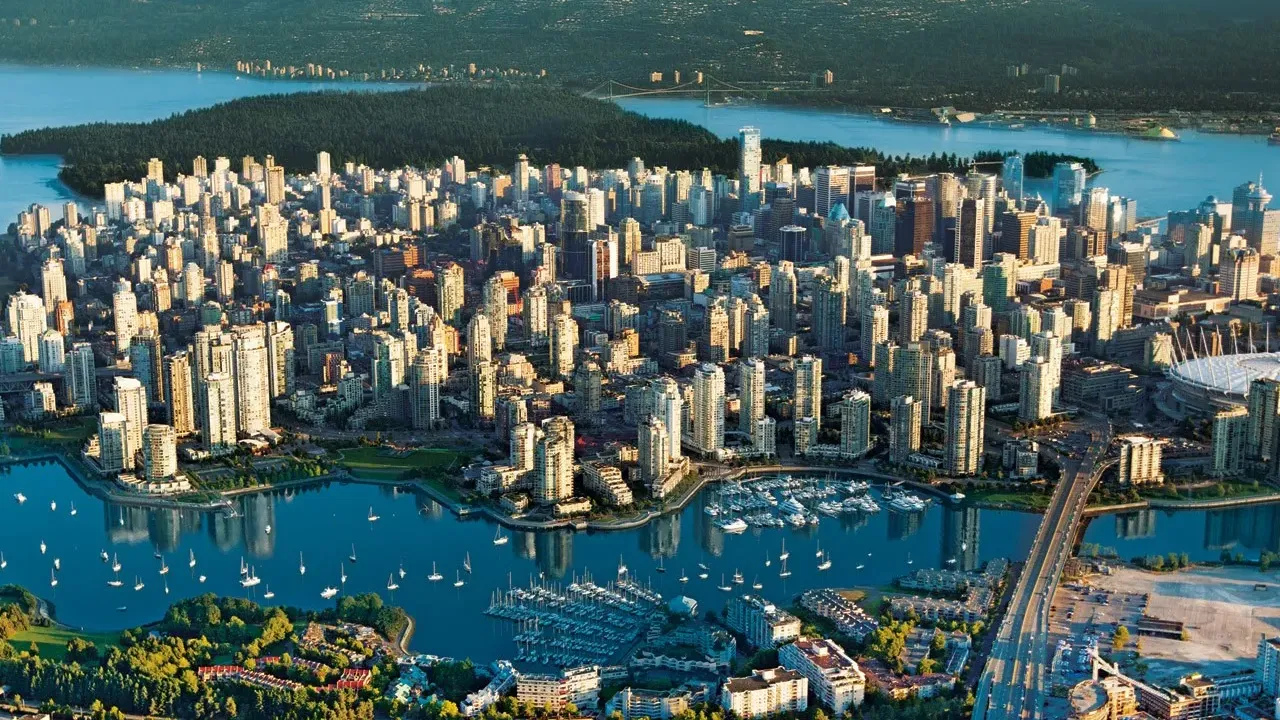 Downtown Vancouver from an aerial point of view showing the city's beautiful surrounding ocean fronts.