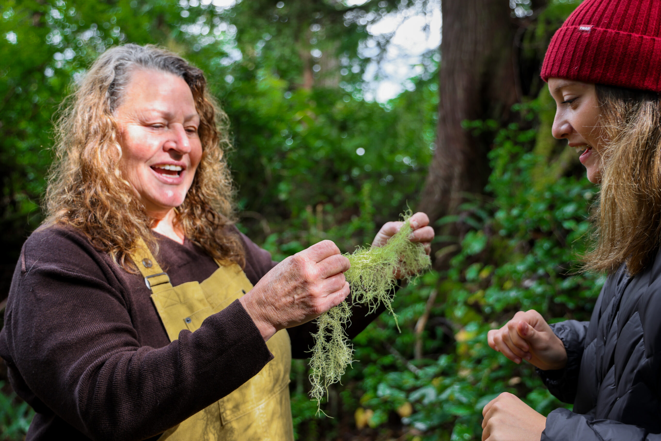 a woman holding a plant