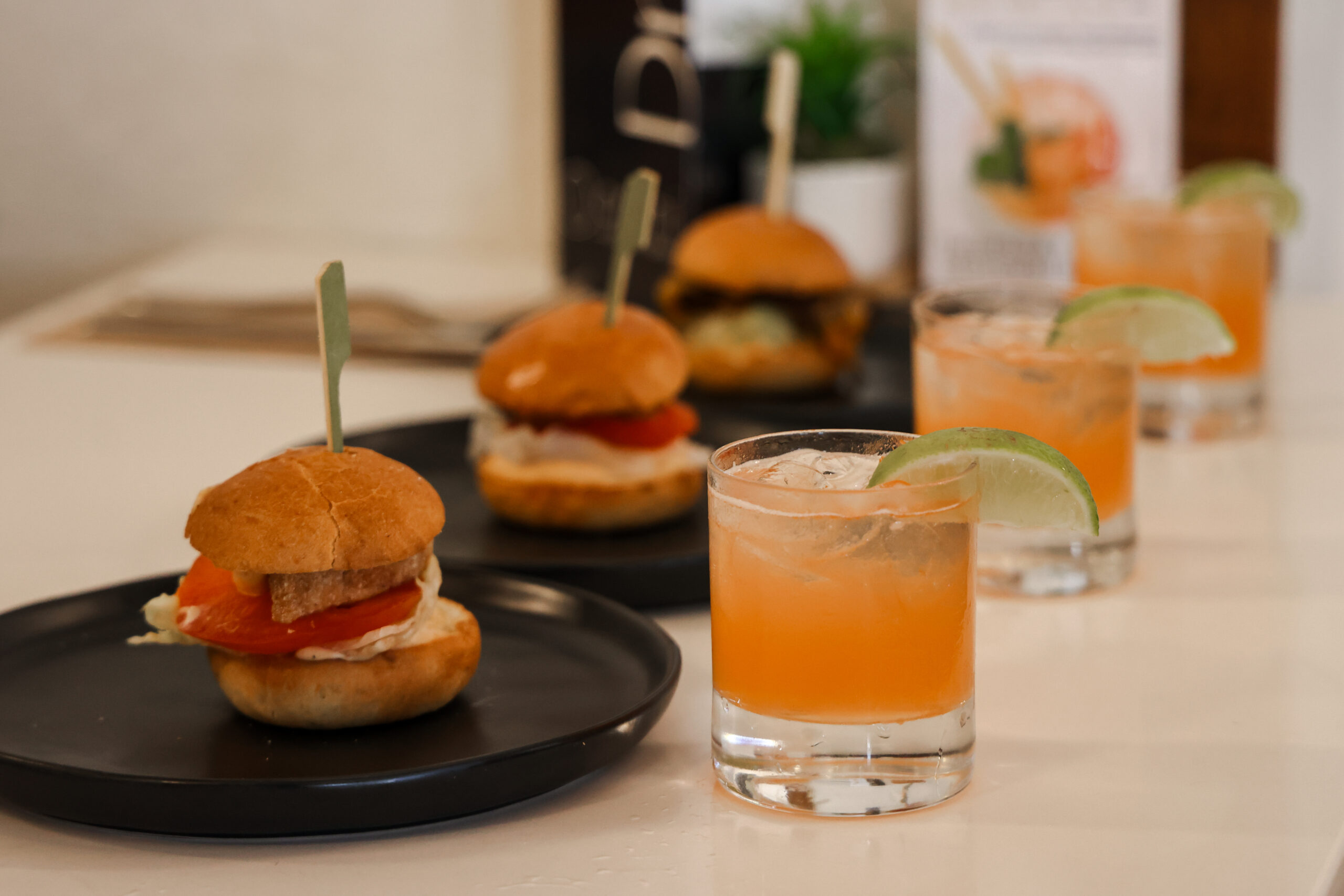 sliders and drinks on a table