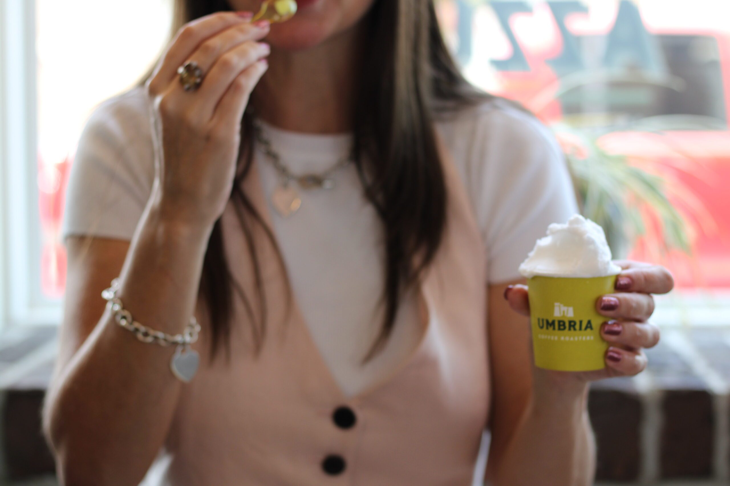 woman holding a cup of gelato